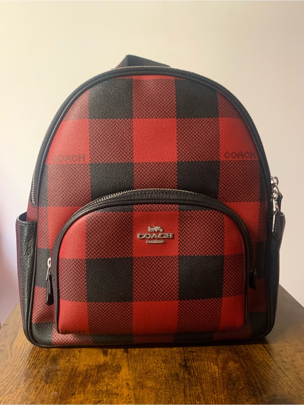 coach paid red and black backpack